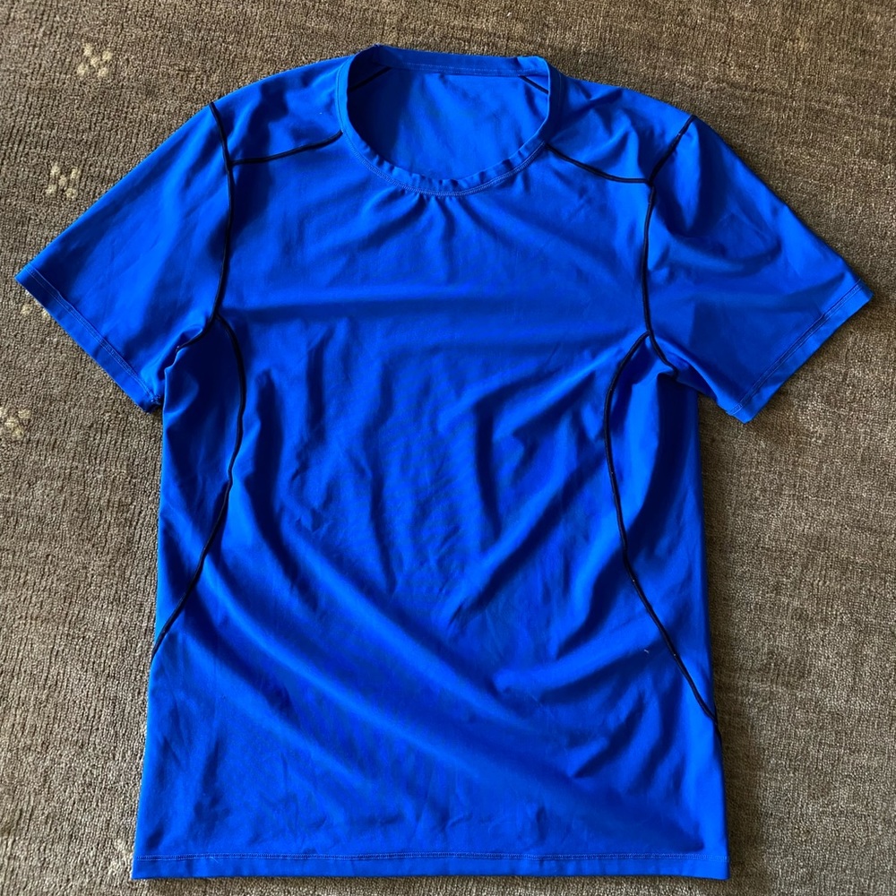 Mens Patagonia top in color blue. Size medium.